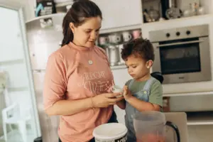 A mother and child in a home kitchen