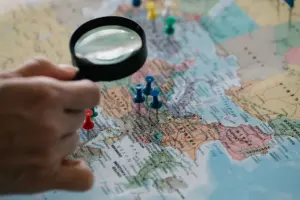 A paper travel map with pins and notes for trip planning